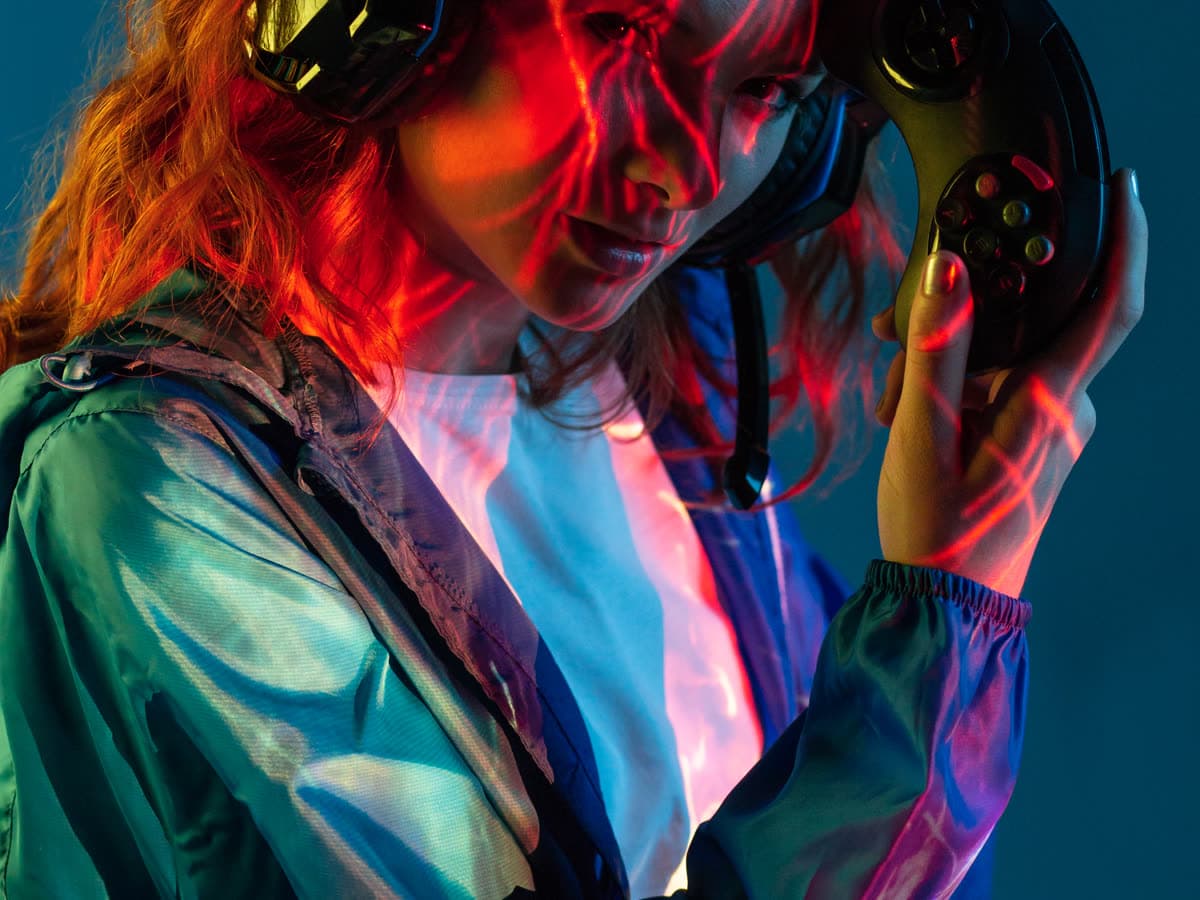 Low-lit lounge scene under coloured lighting